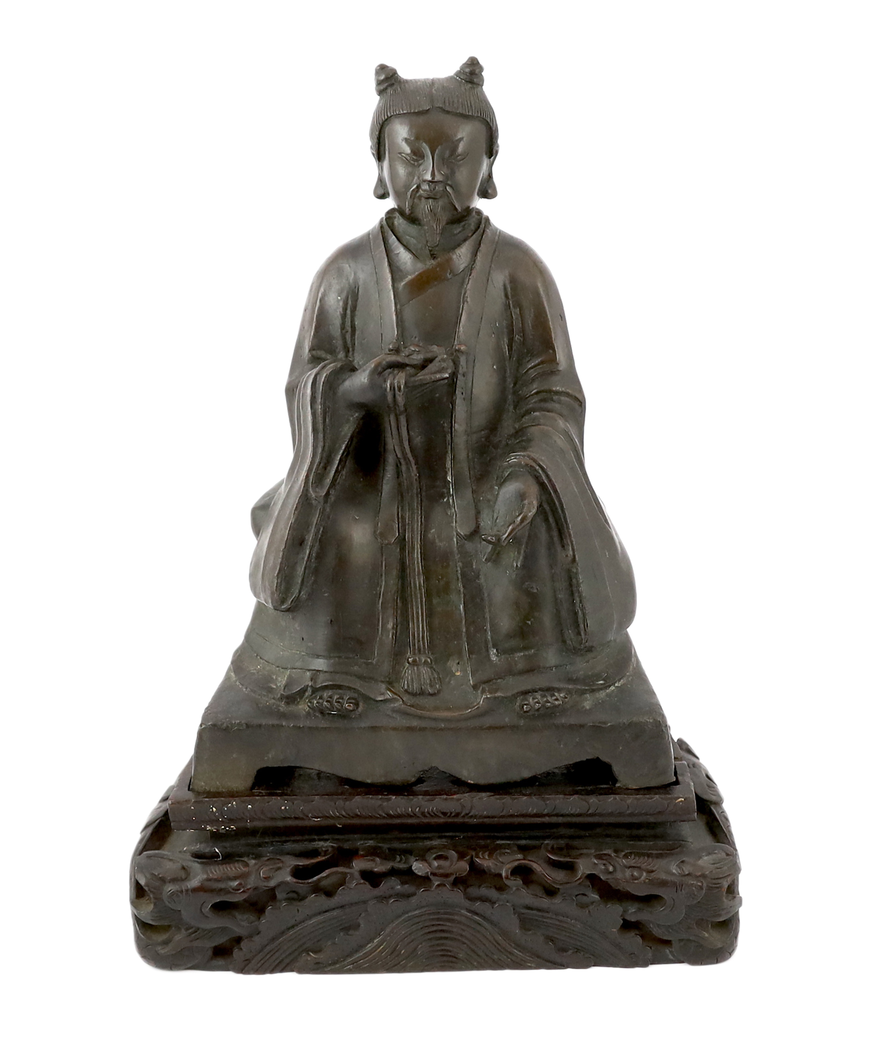 A Chinese bronze figure of a Daoist deity, late Ming, losses to back of throne